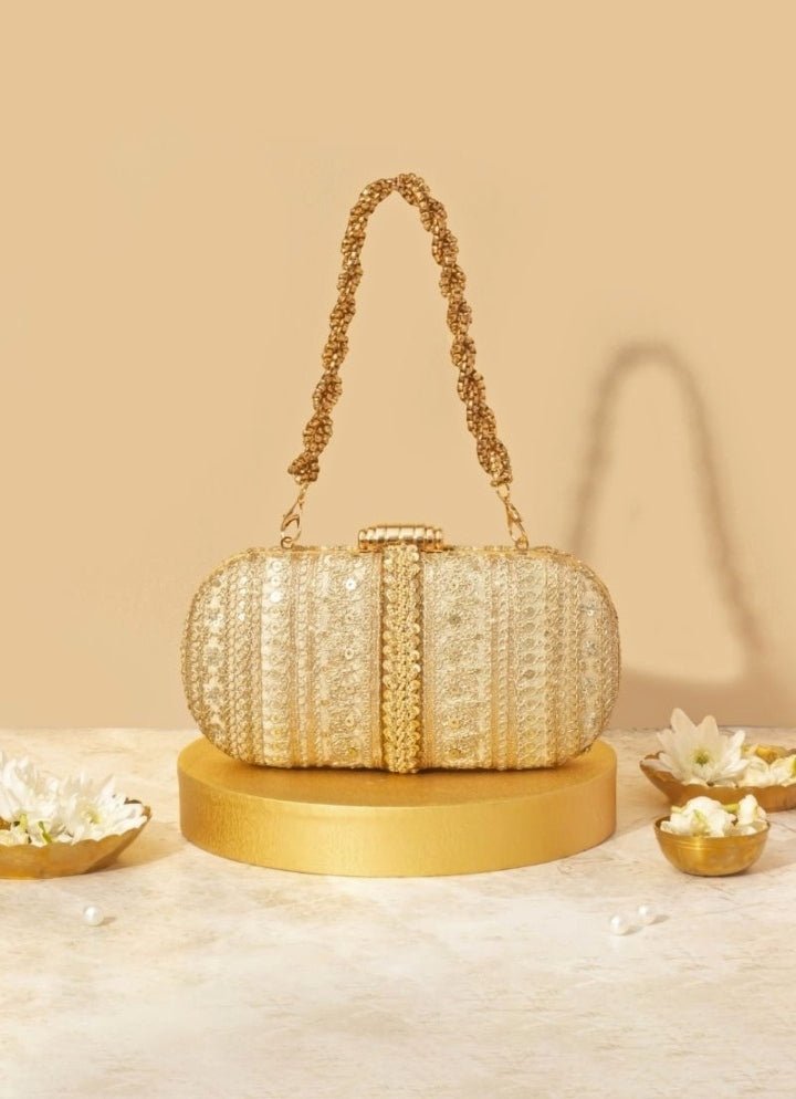 Gold embellished clutch bag